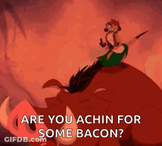 Timon From The Lion King Is Riding On The Back Of A Pig And Says `` Are You Achin For Some Bacon ? '' GIF