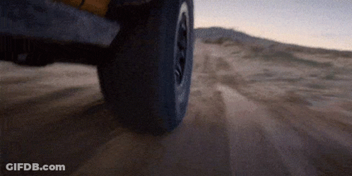 Tire On Sandy Road Close Up GIF