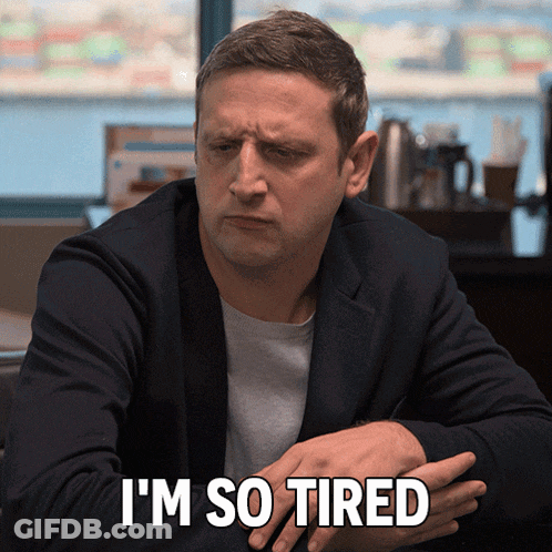 Tired Man Sitting At Table GIF