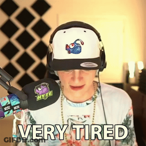 Tired Man Wearing Headphones And Hat GIF