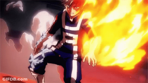 Todoroki Shouto From My Hero Academia Is Standing In Front Of A Wall With Fire Coming Out Of His Hand . GIF