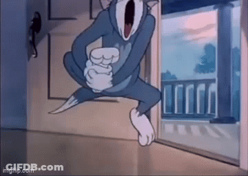 Tom And Jerry Are Jumping In The Air In A Cartoon . GIF