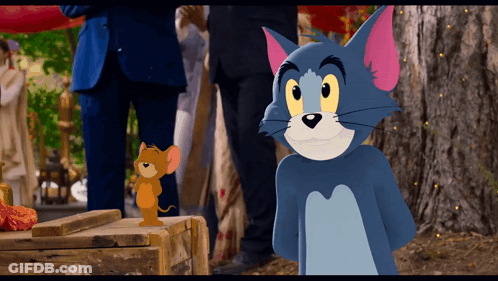 Tom And Jerry Are Standing Next To Each Other GIF