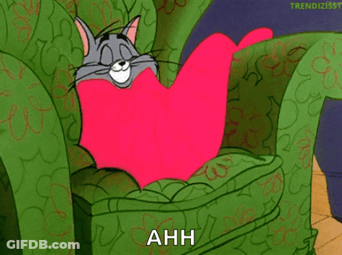 Tom And Jerry Laying On Chair With Heart Pillow Saying Ahh GIF