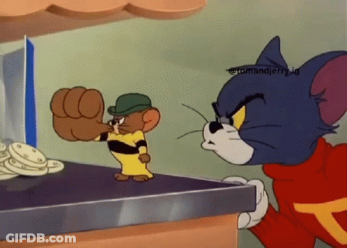 Tom And Jerry Standing On A Table GIF