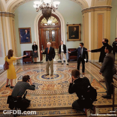 Tom Brenner Reuters Photographing Group In Hallway GIF