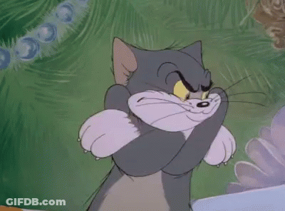 Tom Cat Hugging Paws And Smiling GIF