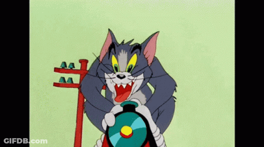 Tom Cat Riding Toy Train GIF