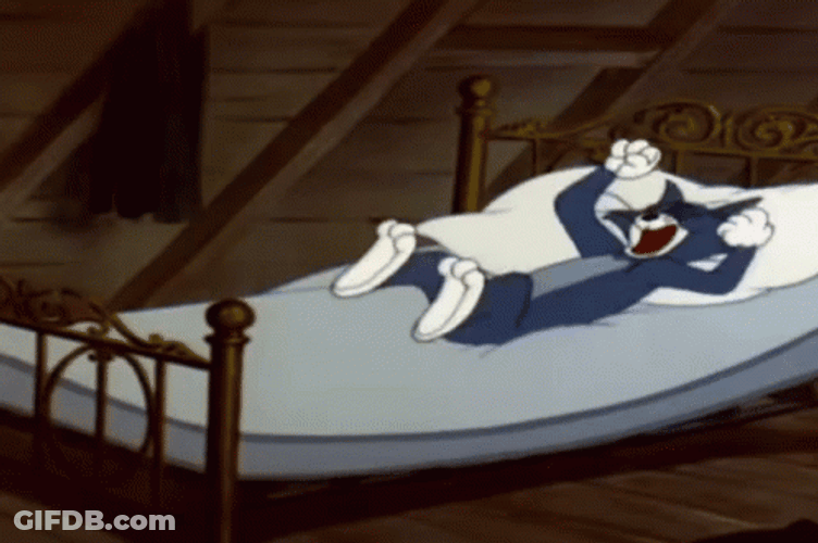 Tom Doing Limb Stretch In Bed GIF