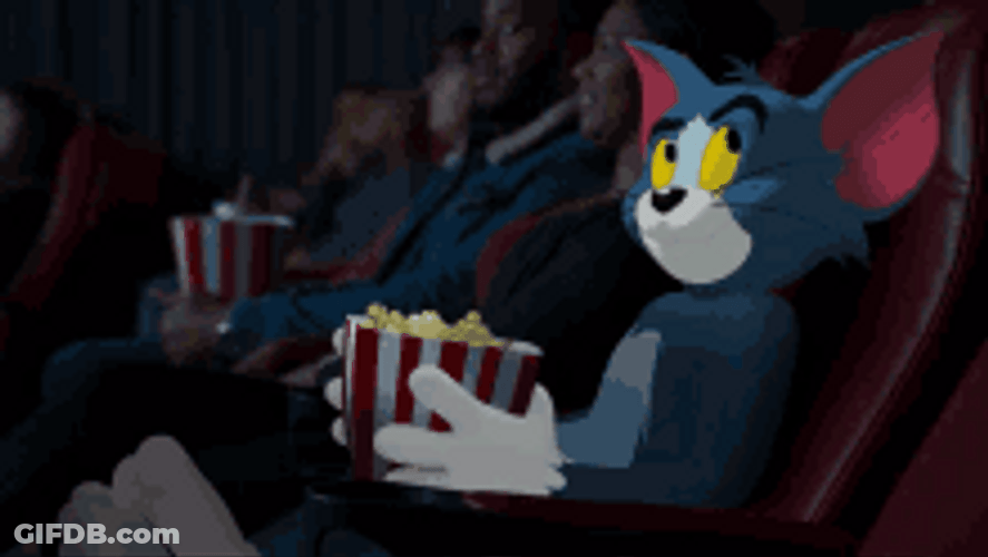 Tom Eating Popcorn Watching Movie GIF