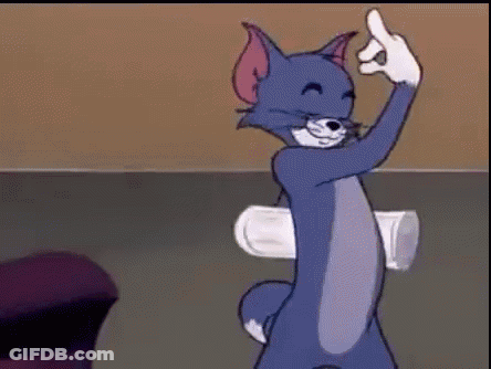 Tom From The Cartoon Tom And Jerry Is Giving The Middle Finger While Holding A Cup . GIF