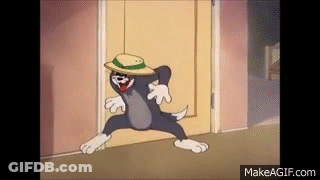 Tom From Tom And Jerry Is Wearing A Hat And Dancing In A Doorway . GIF
