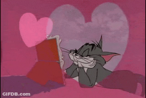 Tom Looking At Mirror With Pink Heart GIF