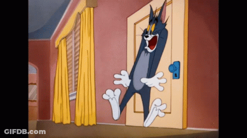 Tom Standing In Front Of Door GIF