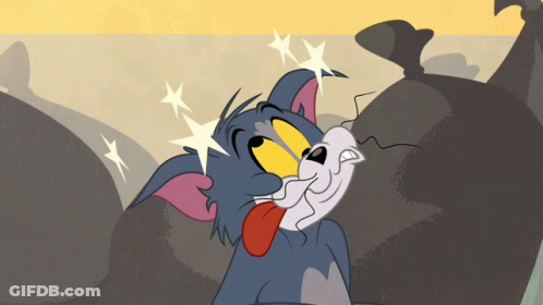 Tom Sticking Tongue Out By Trash Bags GIF