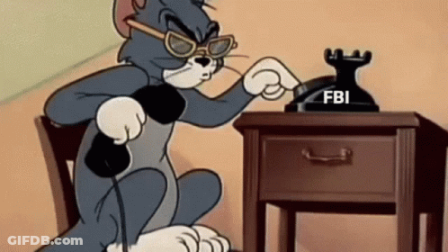Tom Talking On FBI Phone GIF