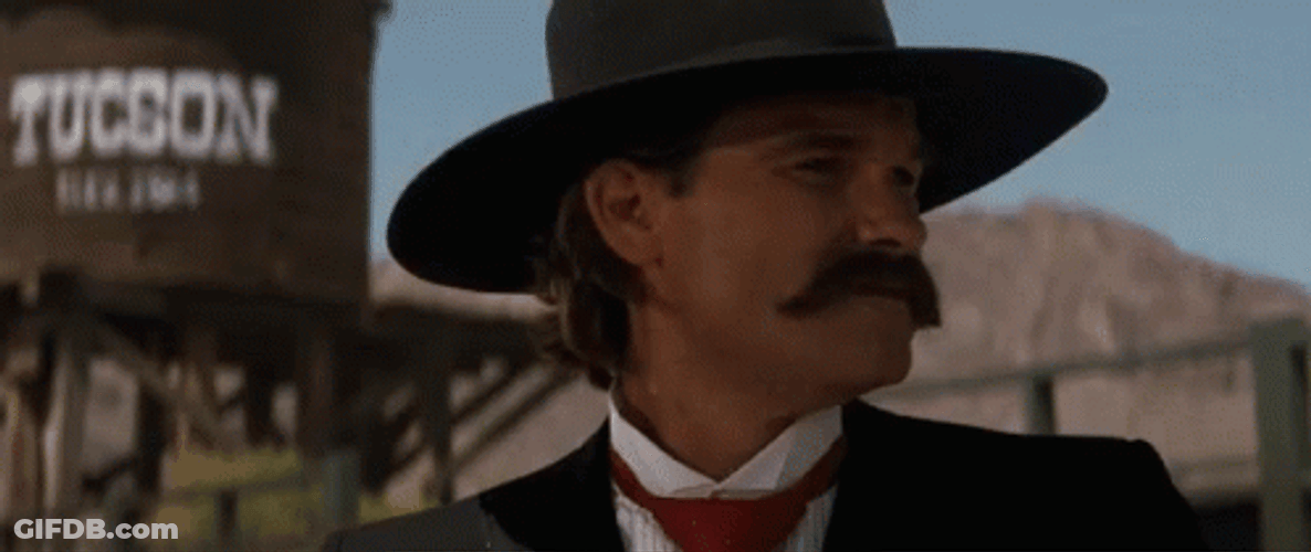 Tombstone Kurt Russel Laughing Hard GIF