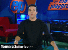 Tommy Tallarico Is Dancing In Front Of A Cd Logo GIF