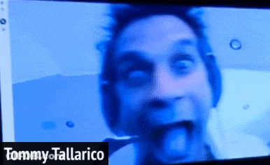 Tommy Tallarico On Screen With Man Sticking Tongue Out GIF