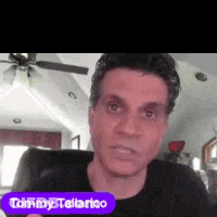 Tommy Tallarico Sitting In Chair With Ceiling Fan GIF