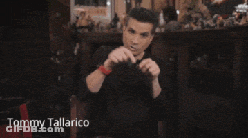 Tommy Tallarico Sitting In Front Of Fireplace GIF