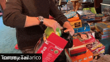 Tommy Tallarico Standing In Front Of Toys GIF