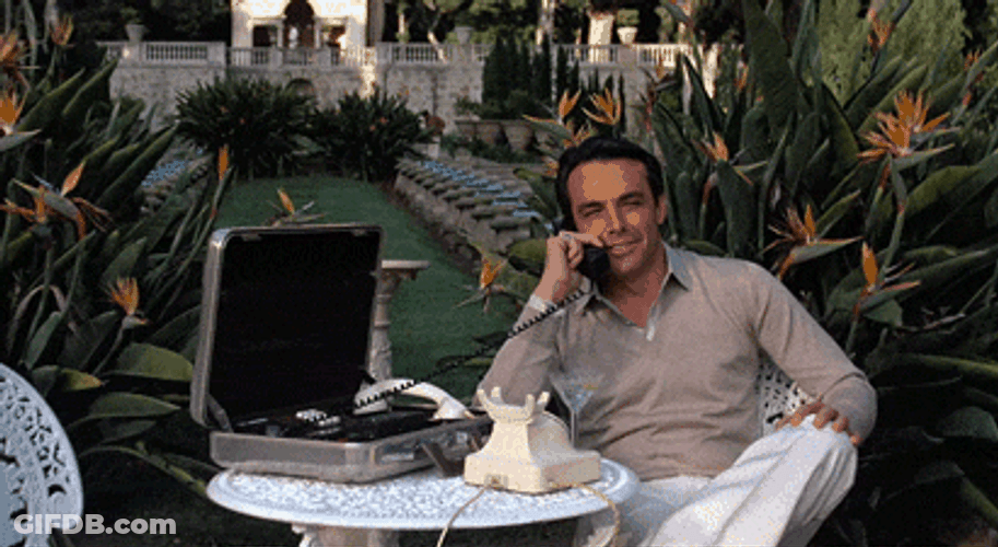 Tony Montana Laughing On Phone GIF