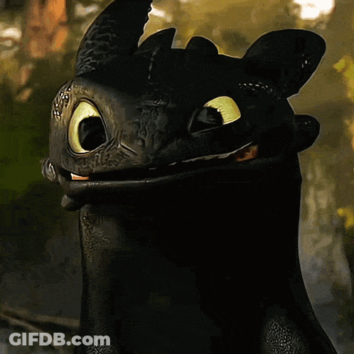 Toothless From How To Train Your Dragon Is Smiling With His Mouth Open GIF