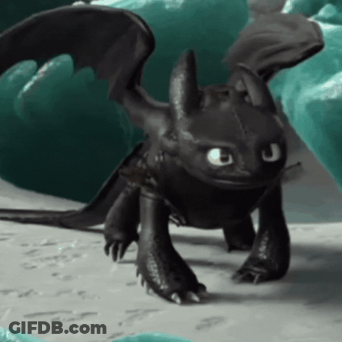 Toothless From How To Train Your Dragon Is Standing On A Rock Looking At The Camera . GIF