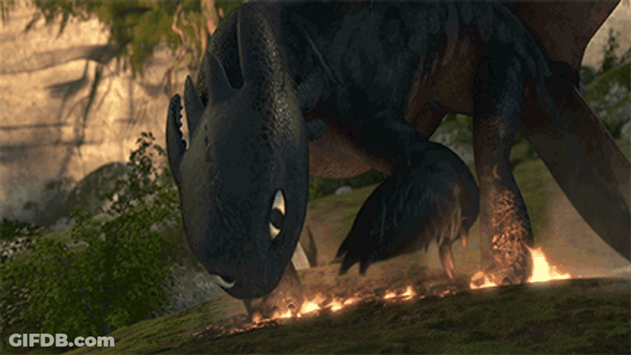 Toothless Laying Down On Fire GIF