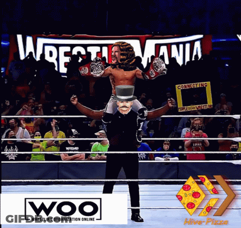Top Hat Man Carrying Man In Woo Ring GIF