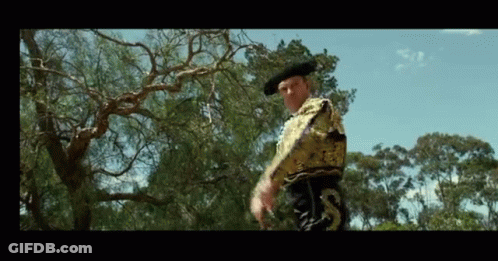 Torero Man Standing By Trees GIF
