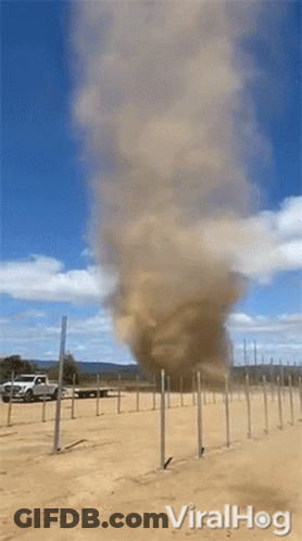 Tornado Coming Out Of Ground With Truck In Background GIF