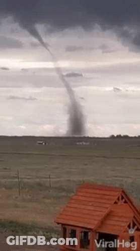 Tornado Moving Through Field With House GIF