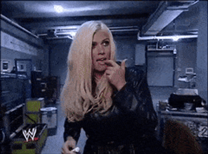 Torrie Wilson Putting On Lip Balm GIF