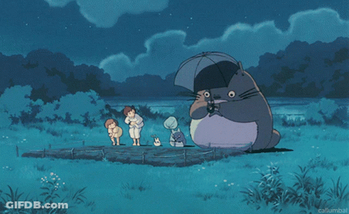 Totoro Holding Umbrella Surrounded By People GIF