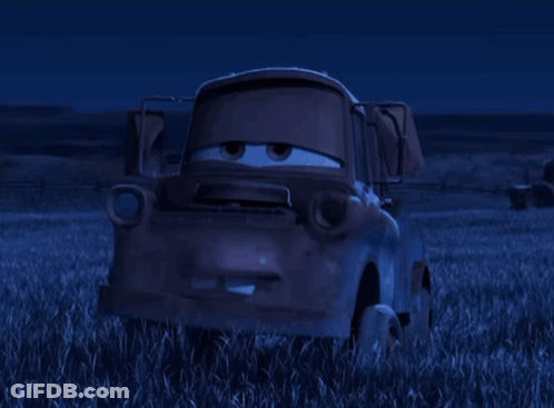 Tow Truck From Cars Sitting In Grass At Night GIF
