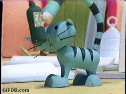 Toy Cat With Bottle On Head GIF