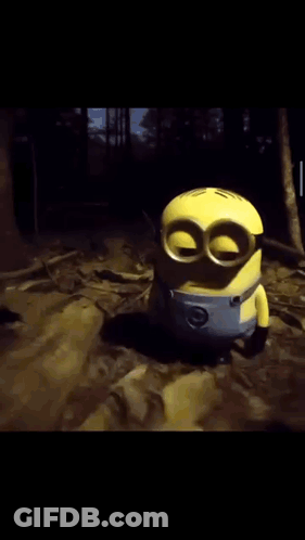 Toy Minion Holding Two Red Balls GIF