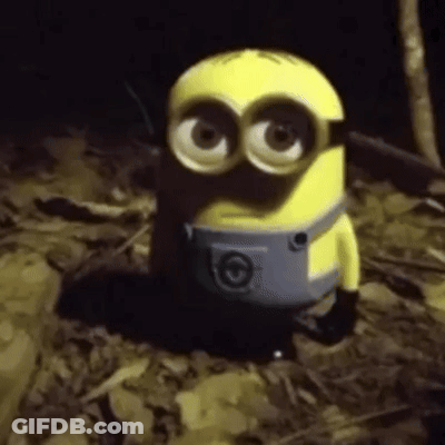 Toy Minion Sitting In Darkness GIF