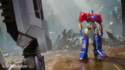 Toy Robot Standing On Concrete Floor GIF
