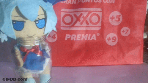 Toy Standing In Front Of Red Premia Bag GIF