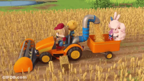 Toy Tractor Pulling Trailer Of Hay And Stuffed Animals GIF