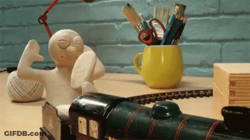 Toy Train Next To Cup Of Pencils GIF