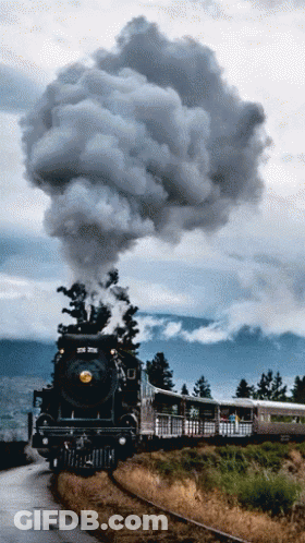 Train Going Down Tracks With Smoke GIF