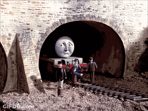 Train With Sad Face Coming Out Of Tunnel GIF