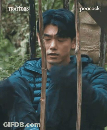 Traitors Ad Man Laying In Woods GIF