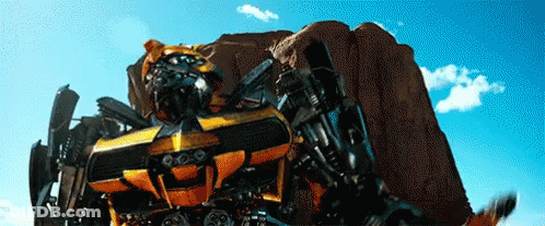 Transformer Robot Standing In Front Of Desert Rock GIF
