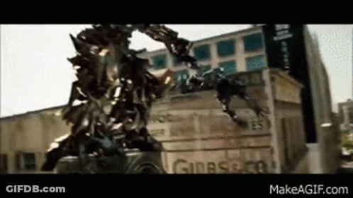 Transformer Standing By City Building GIF