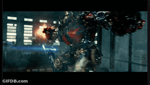 Transformer With Gun Fighting Robot GIF